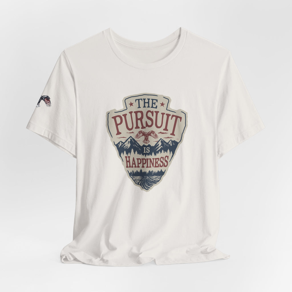 White t-shirt with 'The Pursuit is Happiness' graphic design on a light gray background