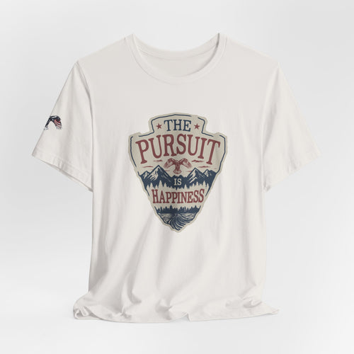 White t-shirt with 'The Pursuit is Happiness' graphic design on a light gray background